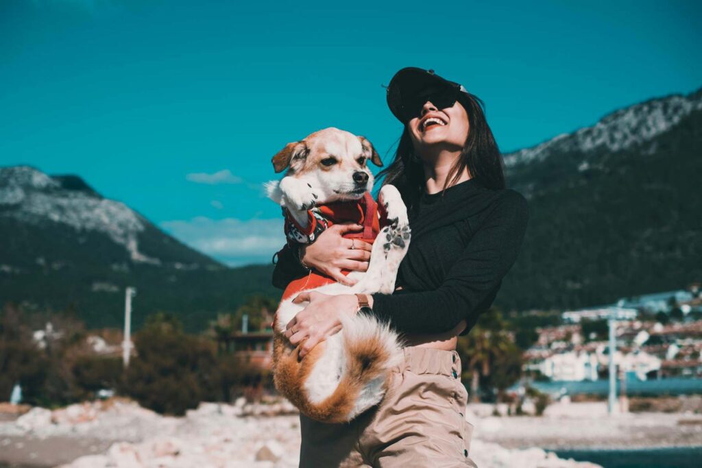 woman and dog on mountains