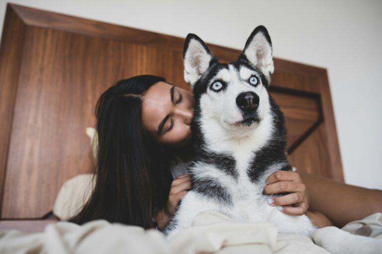 woman loving on dog