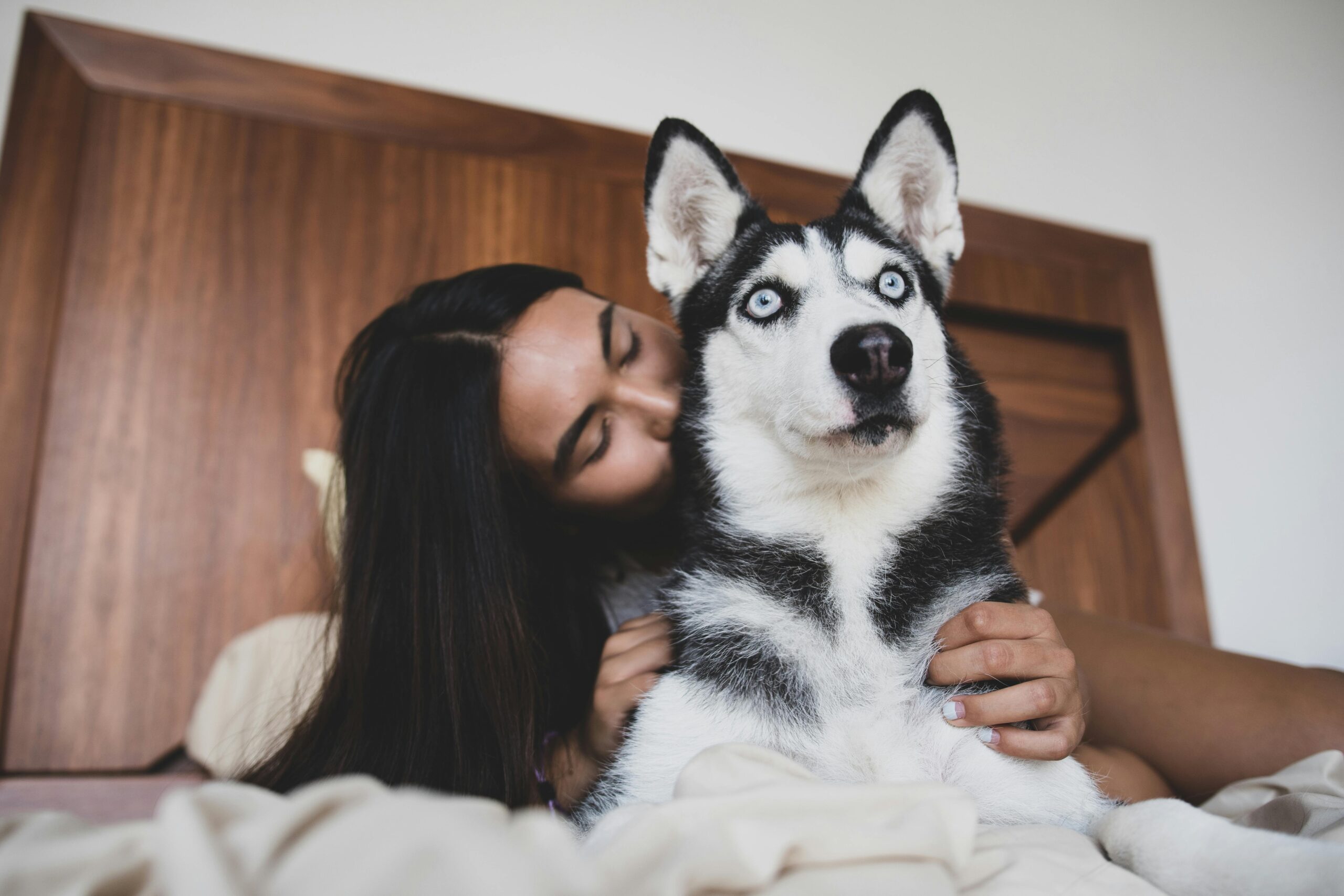 woman loving on dog